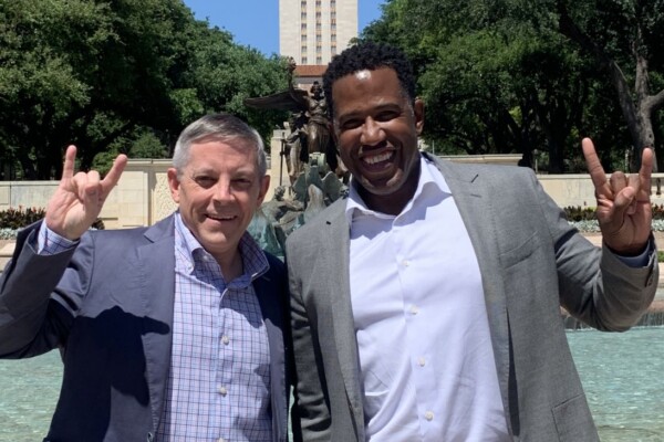 Mitch Bramlett, BBA ’92, MPA ’92, and Rod Adams, PwC’s advisory people & inclusion leader, show Longhorn pride during a campus visit last spring.