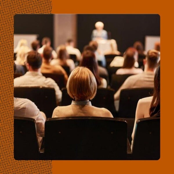 Upcoming events graphic showing back of woman's head in lecture hall
