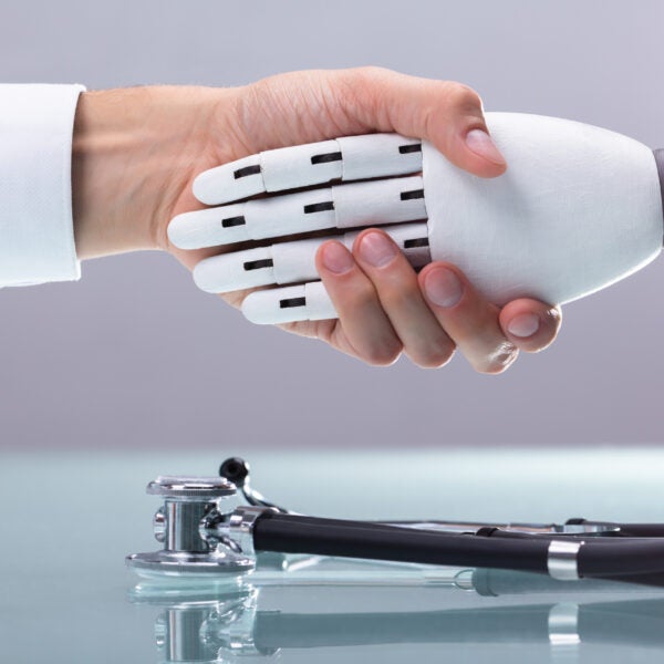 Doctor And Robot Shaking Hands