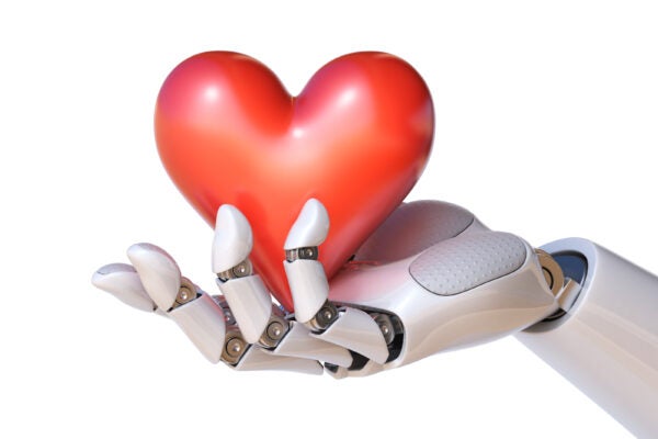 Robot hand holding a heart 3d rendering