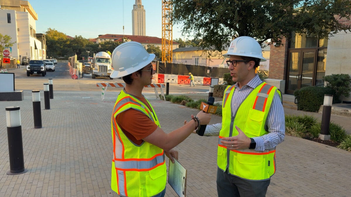 Freshman Business Honors student Diego Beyer interviews Ethan Burris, senior associate dean for academic affairs, before a construction tour of Mulva Hall. When Beyer asked about opening day, Burris said he hopes McCombs donors “feel a sense of pride.”