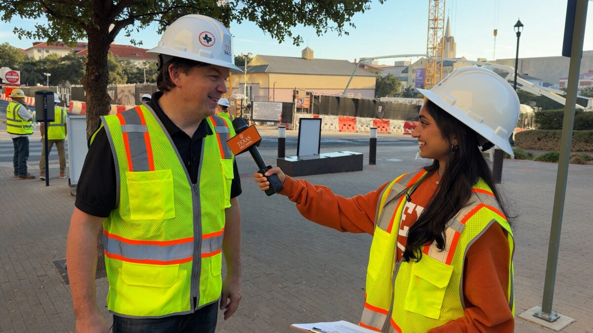 Associate Dean for Undergraduate Programs Ty Henderson tells freshman Varshini Byreddy that Mulva Hall’s fourth floor promises to be a favorite student hangout. They spoke during an interview at the building’s construction site.